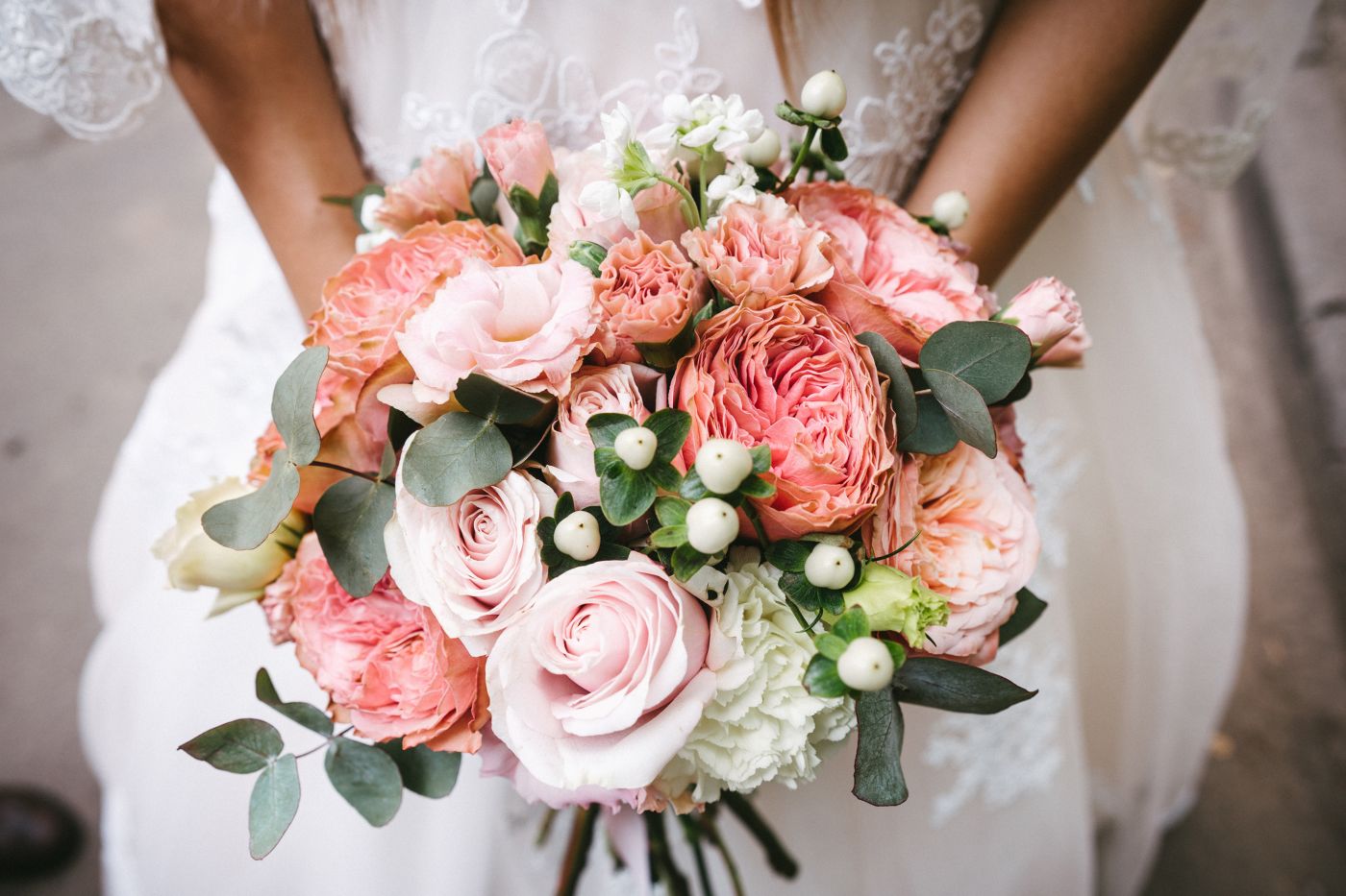 Bride holding bouquet of pink and white flowers